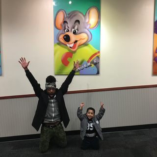 I returned to Chuck E. Cheese’s 17 years later as a civilian with my homegirl Yvonne and her son, Kenzo. (courtesy of author)